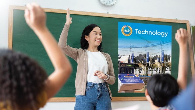 students raising hands infront of teacher